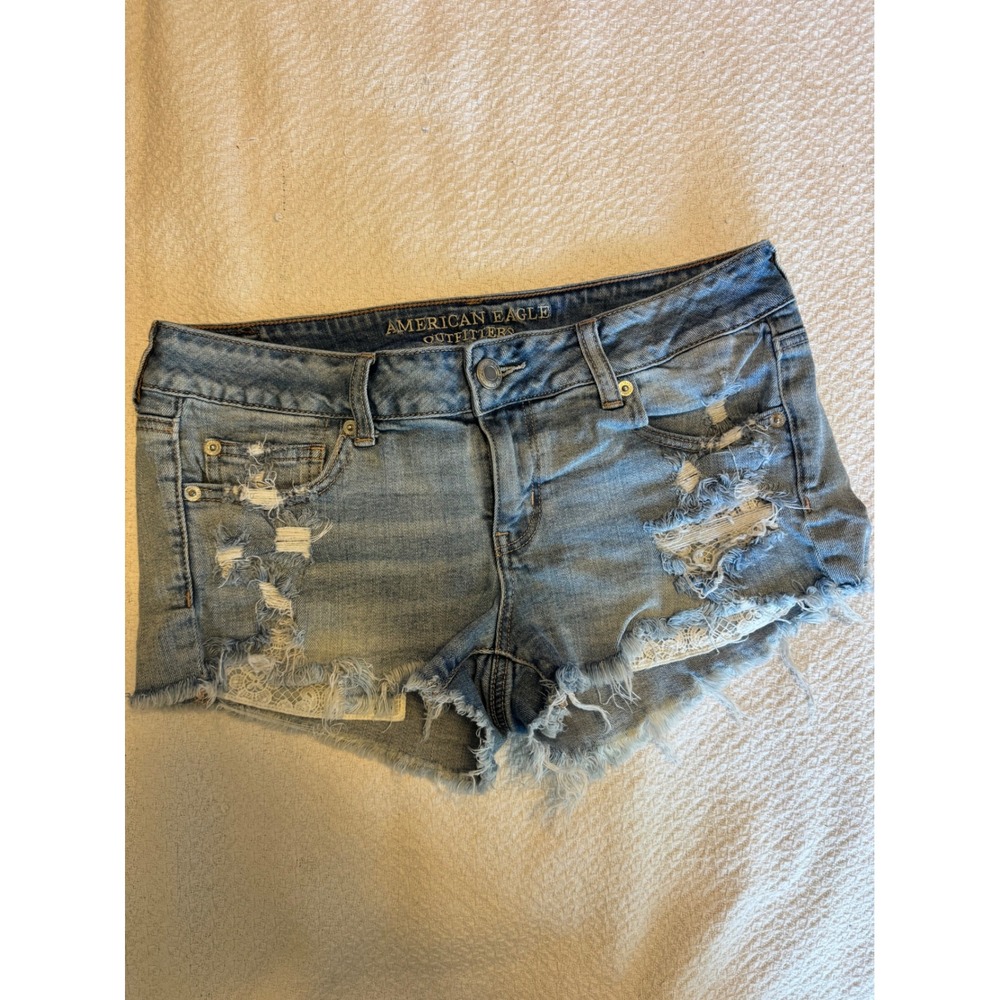 American Eagle Super Low Rise Distressed Denim Shorts Lace Detail Medium Wash 10